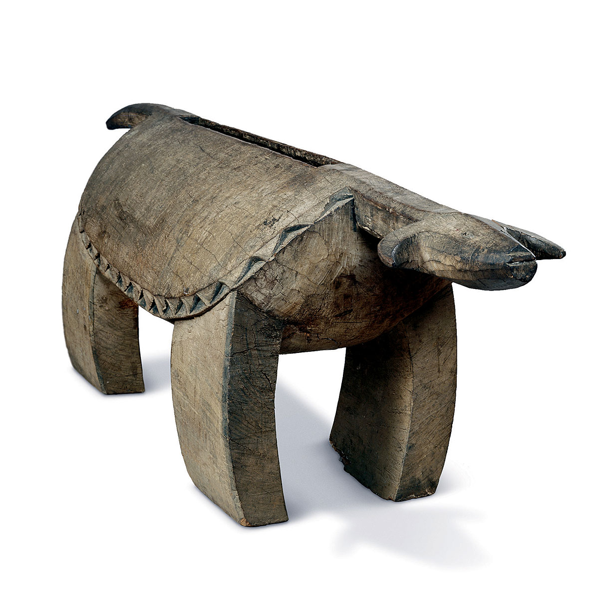 This photo shows an African slit drum that is in the form of a water buffalo.