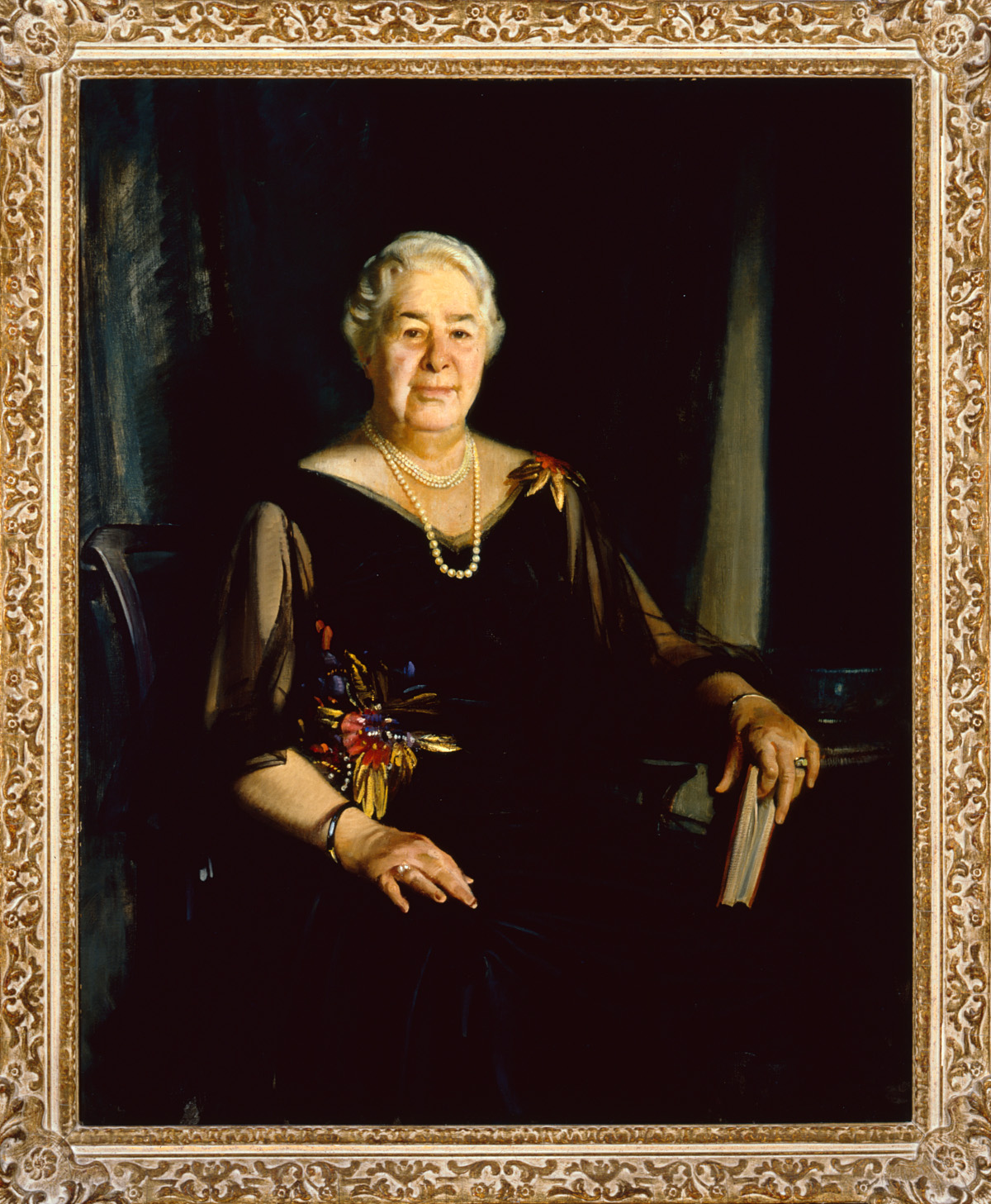 The image shows this month's featured artwork, John Christen Johansen's portrait of Julia Shaw Patterson Carnell, painted in 1940.