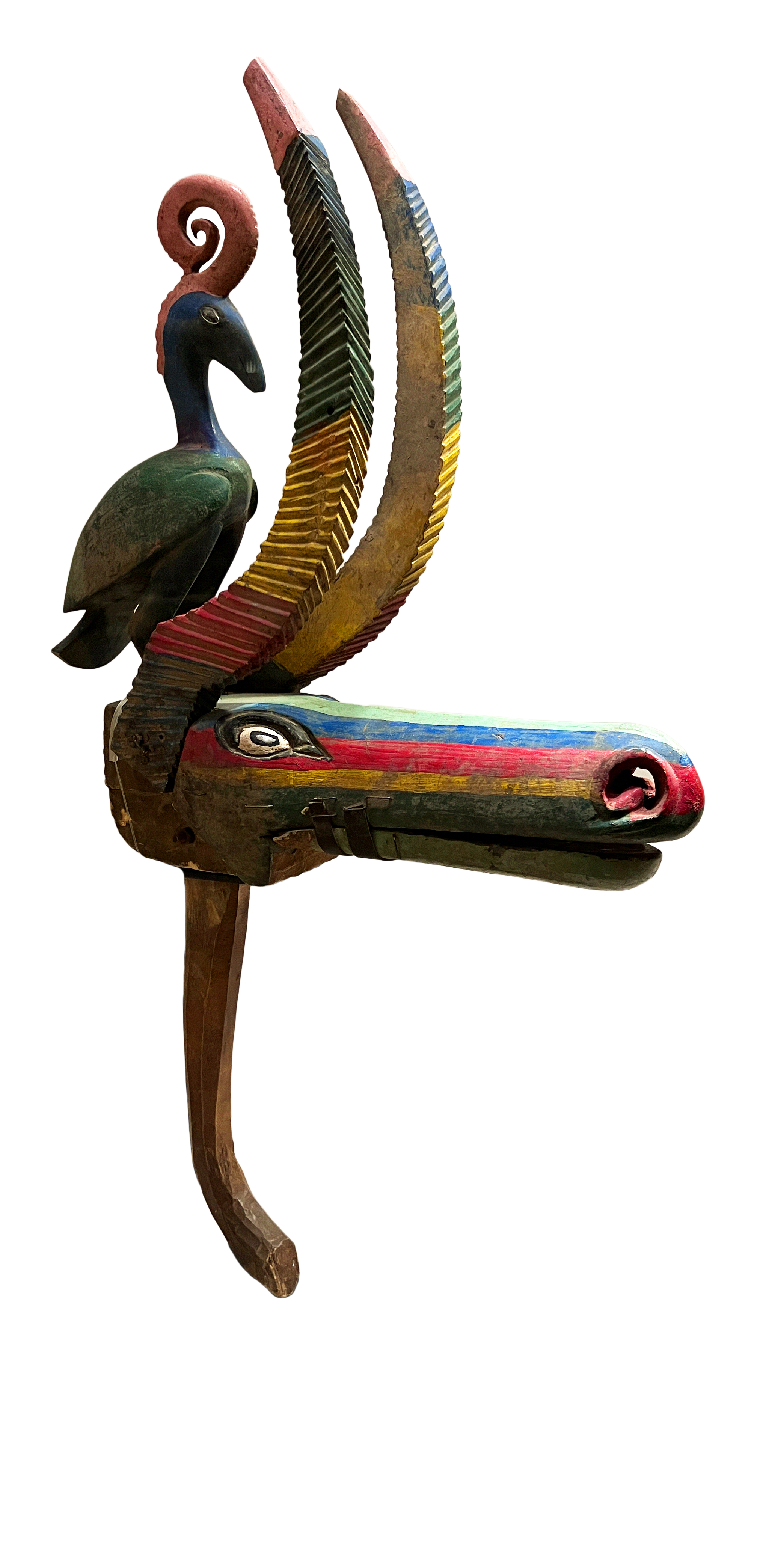 African sculpture with bright green, yellow and red colors.