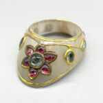 Artist(s) unknown (India), Archer’s Ring, 17th century, jade inlaid with gold, rubies and diamonds. Gift of Brainerd B. Thresher, 1942.124.85